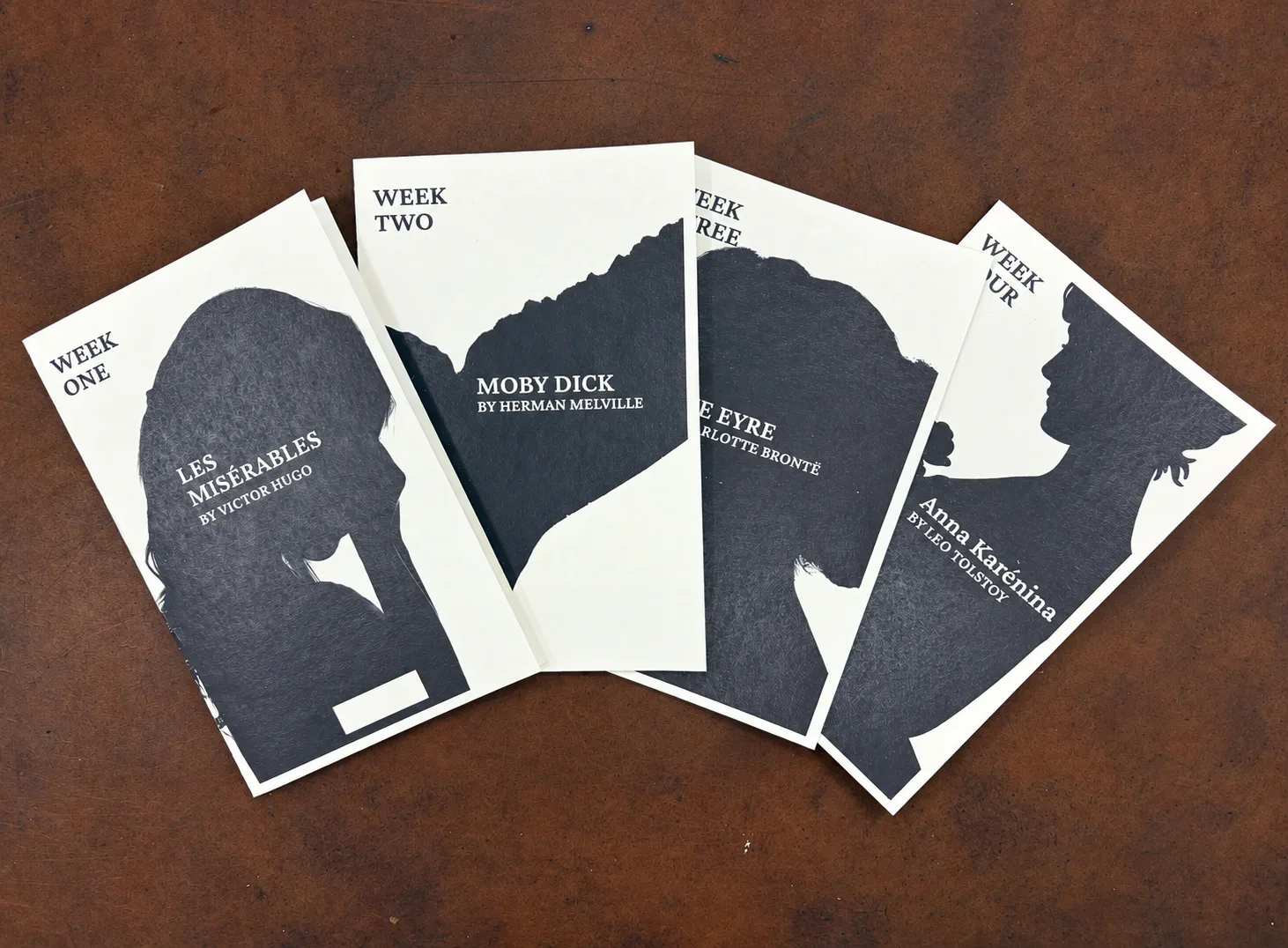 Four weekly Human by Hand packets: Les Misérables, Moby Dick, Jane Eyre, and Anna Karenina