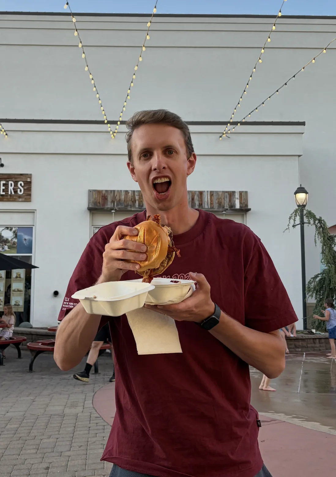 Ryan eating a huge cheeseburger